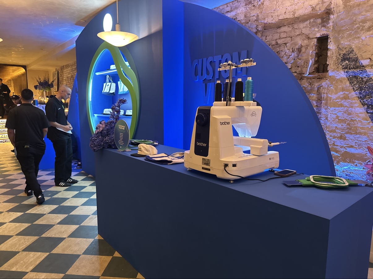 The live embroidery booth set up at a brand event