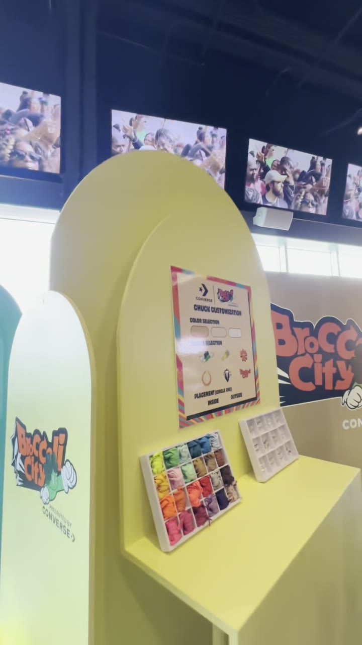 A customization menu and thread color selection at an event booth
