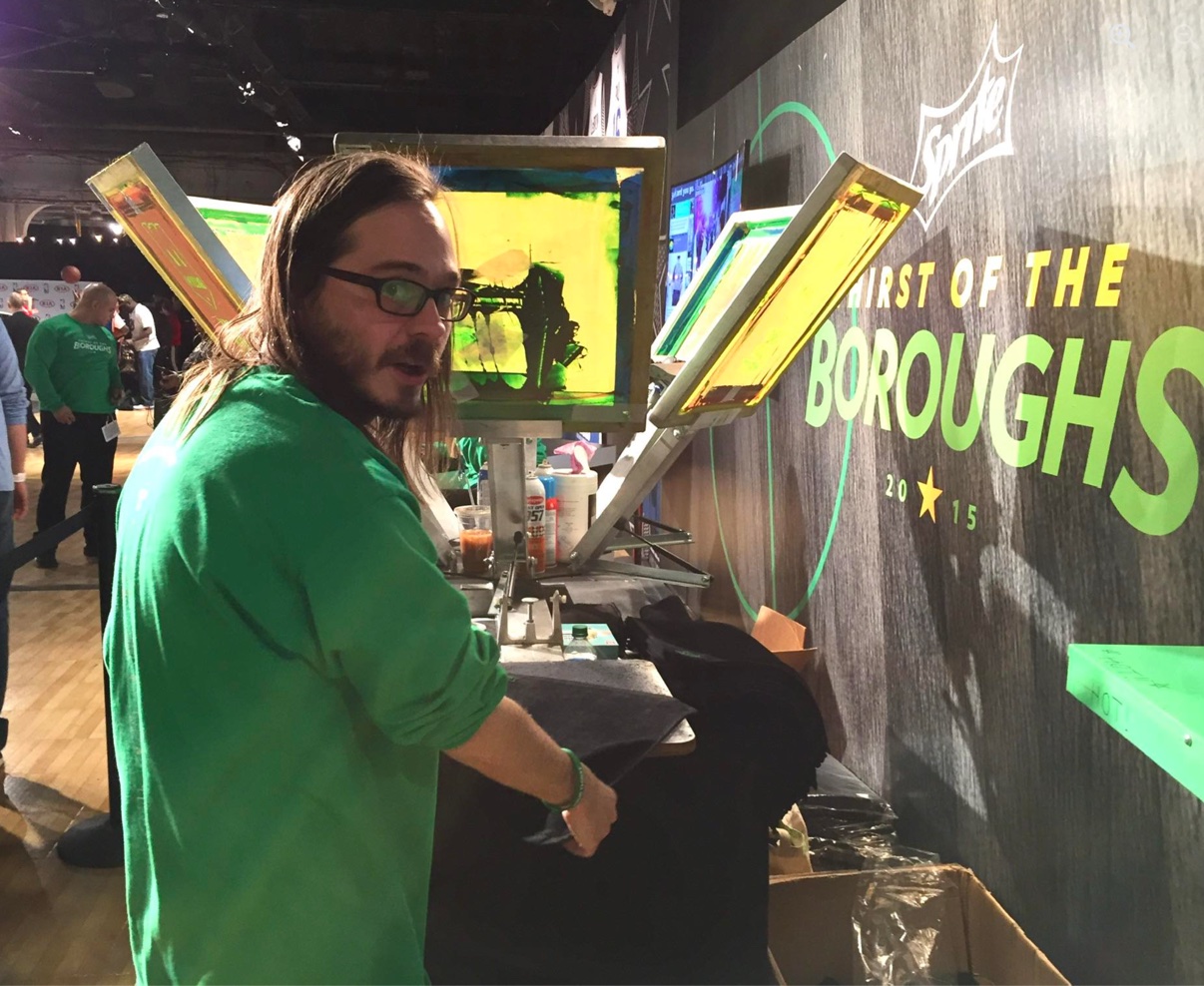 2015, Sprite Thirst of the Boroughs — their press line against the branded wall, a crew member mid-job